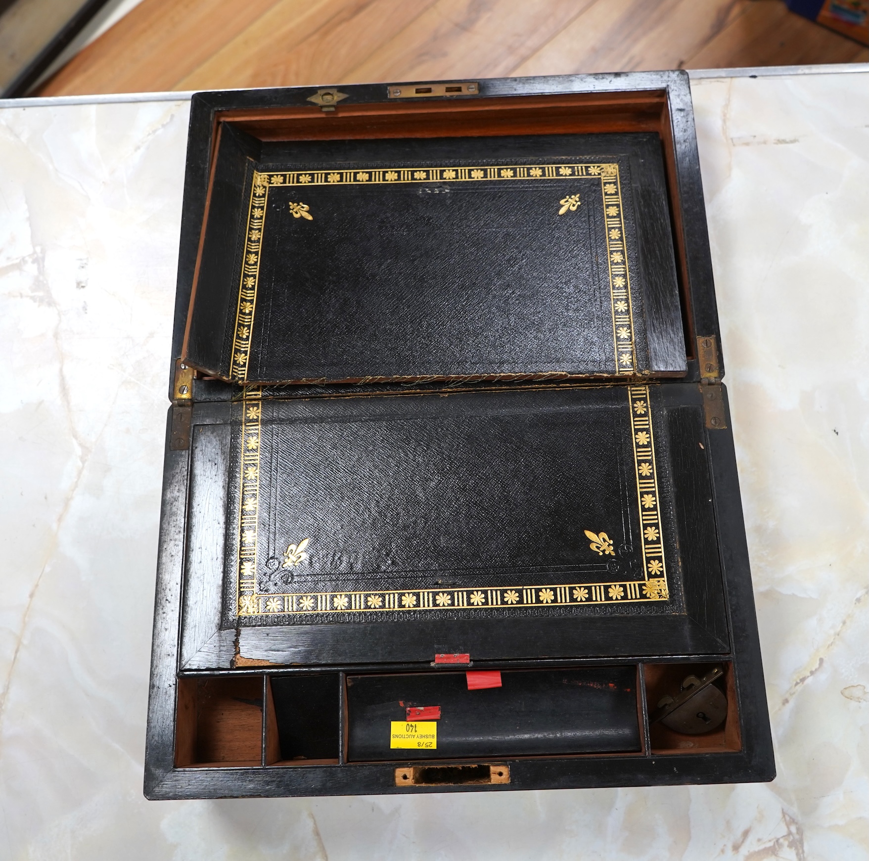 A brass bound walnut writing box with tooled leather slope, 35cm wide